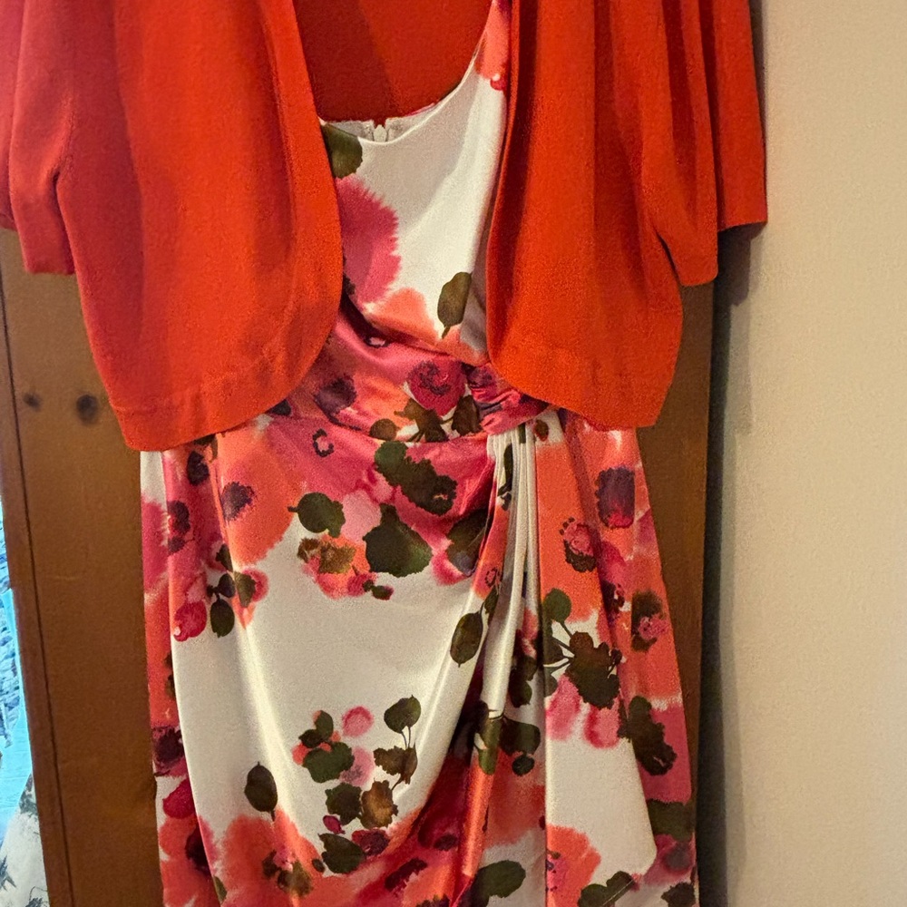 Beautiful sleeveless dress with short orange sweater.